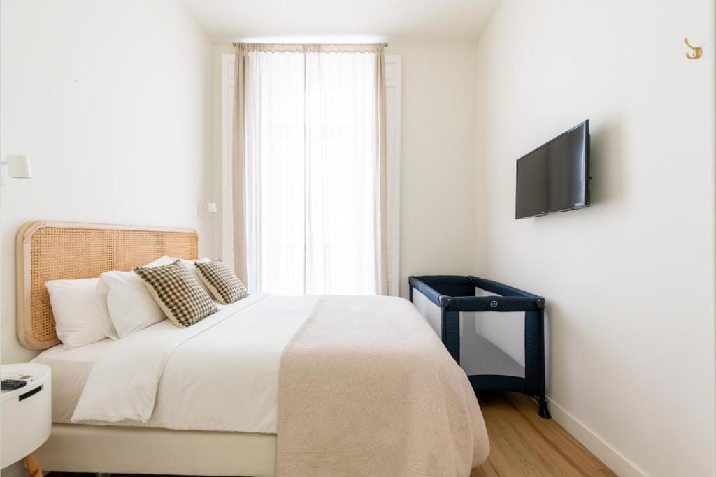 Telewizja i/lub zestaw kina domowego w obiekcie Rodo Charming Apt Sevilla Center by the bullring by Rodo street