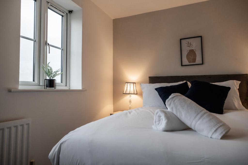 Postel nebo postele na pokoji v ubytování Brecon Gardens