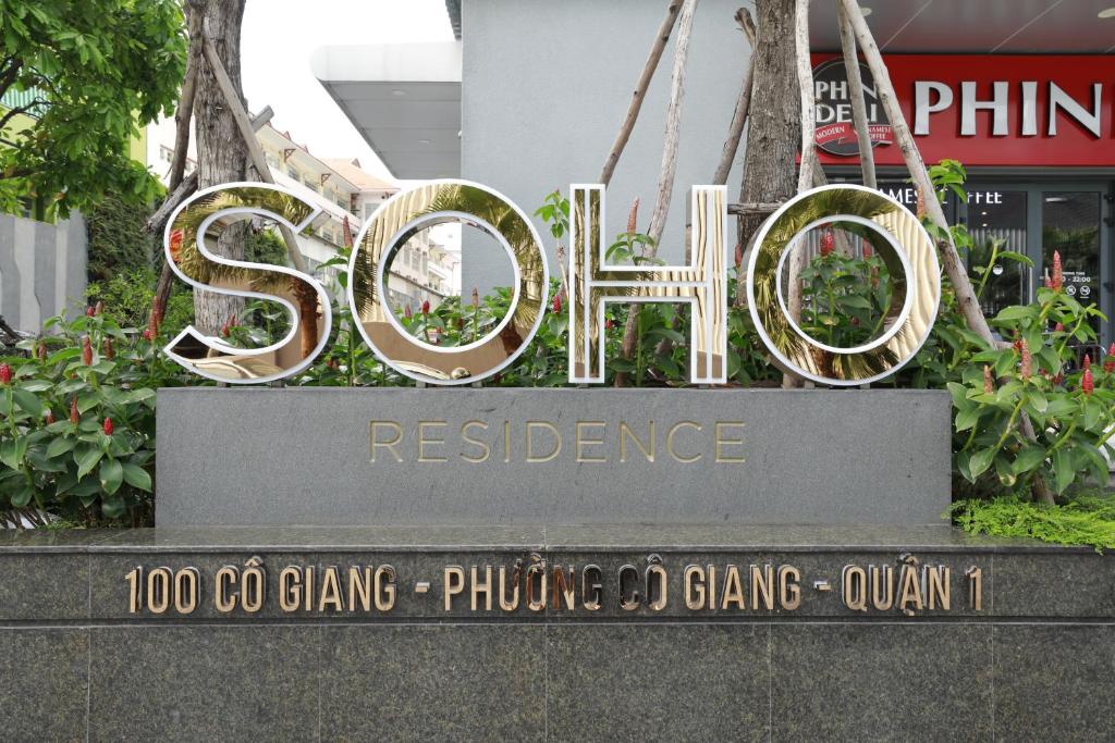 a sign for the sigma restaurant in front of a building at Lisa Apartment - SOHO Residence in Ho Chi Minh City