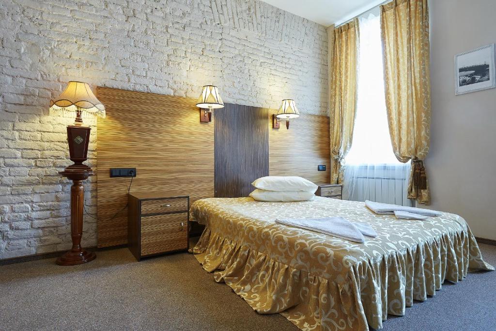 Кровать или кровати в номере Мини-отель Васильевский остров