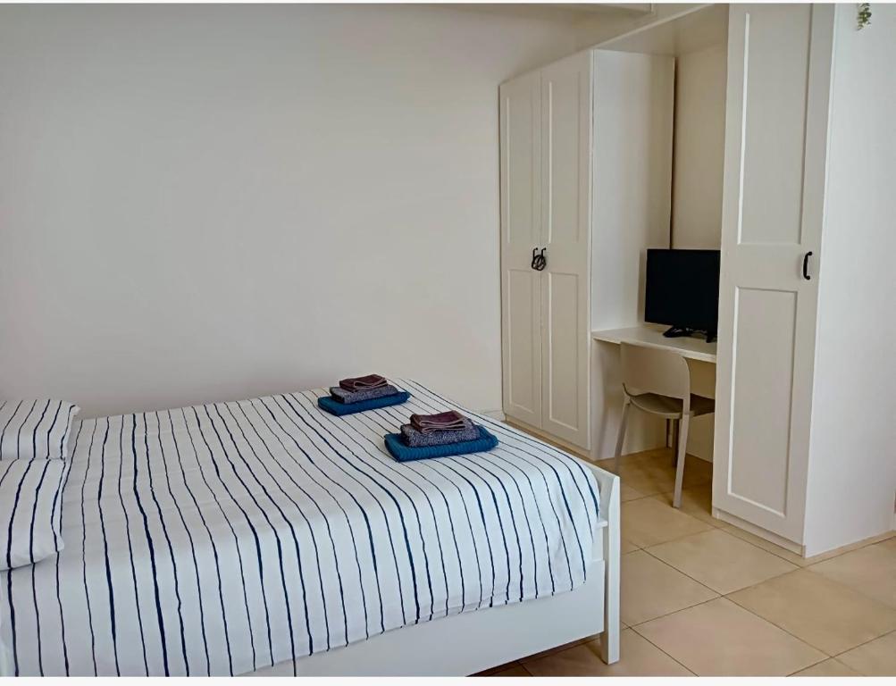 Postel nebo postele na pokoji v ubytování Canottieri home