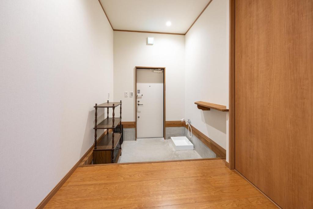 Postel nebo postele na pokoji v ubytování こんぴら町家 Konpira Machiya