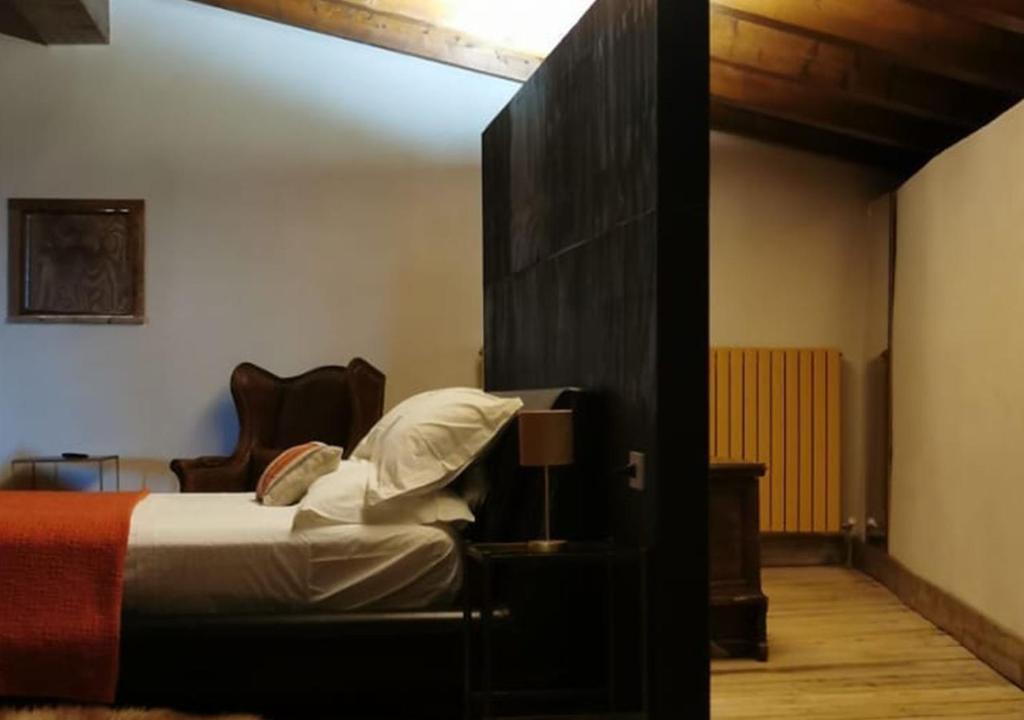 Postel nebo postele na pokoji v ubytování B&B con SPA il Castello di Lucawest