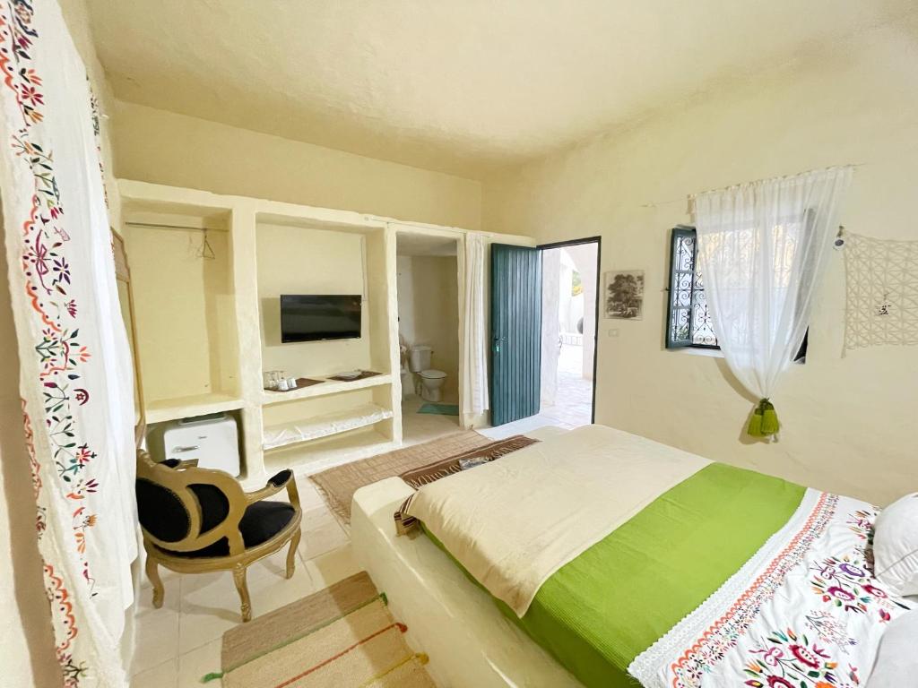 Postel nebo postele na pokoji v ubytování Dar Oueghlani - Maison d'hôtes