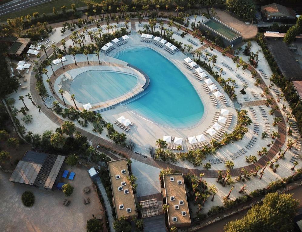 an overhead view of a swimming pool at a resort at Holidays by juliano camping 5 etoiles 3149 in Grimaud