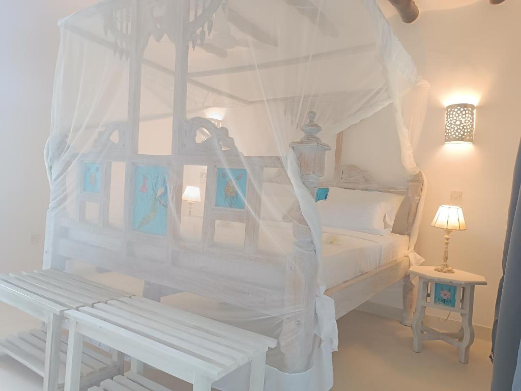 Postel nebo postele na pokoji v ubytování Pole Pole Beach House