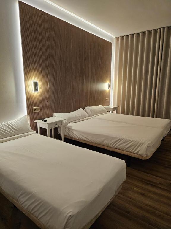Postel nebo postele na pokoji v ubytování Hotel Villasegura