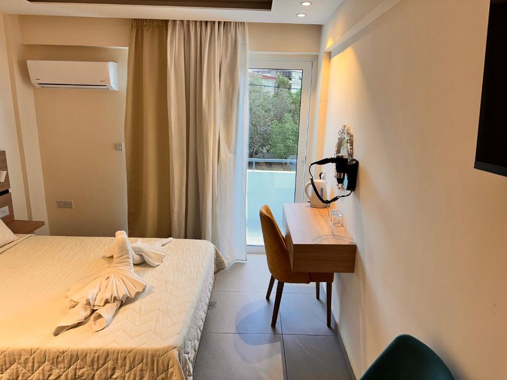 Postel nebo postele na pokoji v ubytování San Remo Hotel