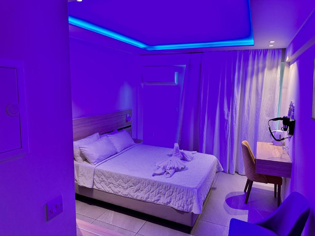 Postel nebo postele na pokoji v ubytování San Remo Hotel
