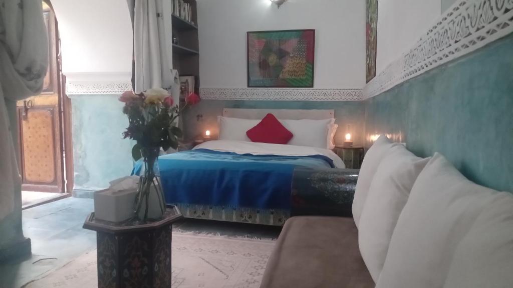 Postel nebo postele na pokoji v ubytování Riad Maizie