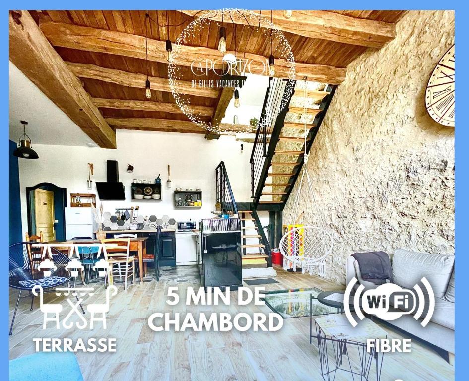 a living room with wooden ceilings and a dining room at CAPORIZON-La Grange-Le Clos de Chambord in Saint-Claude-de-Diray