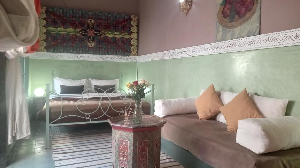Postel nebo postele na pokoji v ubytování Riad Maizie
