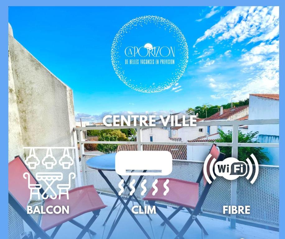 a patio with a table and chairs on a balcony at Caporizon-La Moulinette-5min Gare et Port in La Rochelle