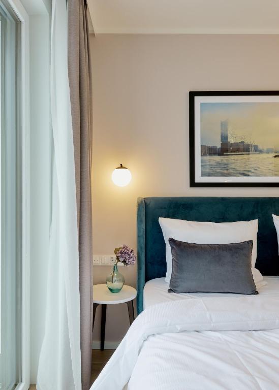 Postel nebo postele na pokoji v ubytování Arbio I Makro Apartments