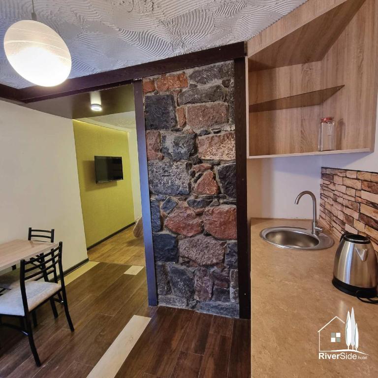 Kuchyň nebo kuchyňský kout v ubytování River House Boutique Hotel