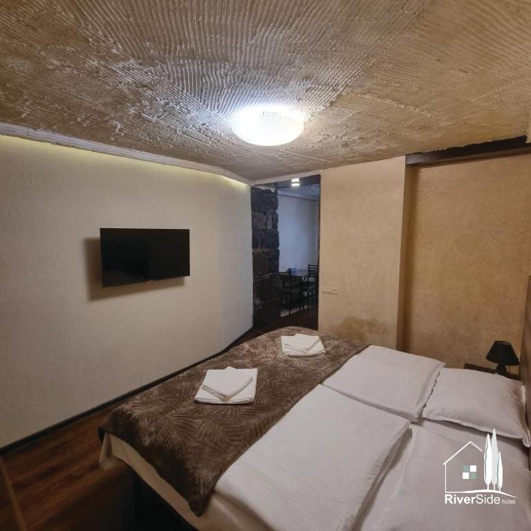 Postel nebo postele na pokoji v ubytování River House Boutique Hotel