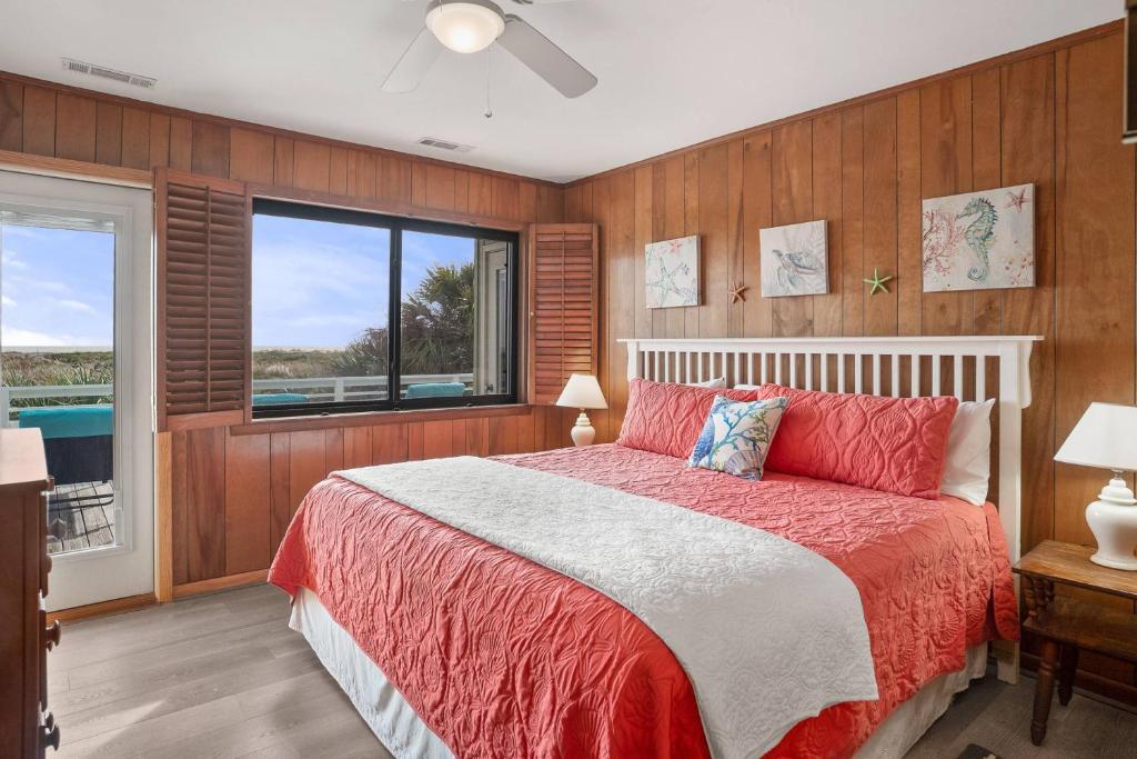 a bedroom with a large bed and a window at Fripp Island 702 Tautog in Fripp Island
