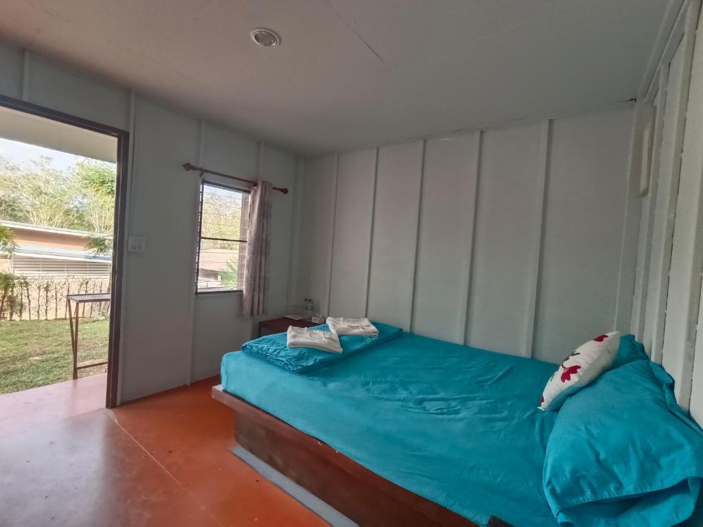 Postel nebo postele na pokoji v ubytování อัญมัน ลันตา Anyaman Lanta
