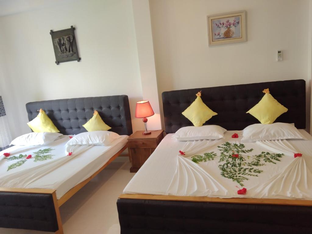 Voodi või voodid majutusasutuse Hotel Sapid Luck Yala Safari toas