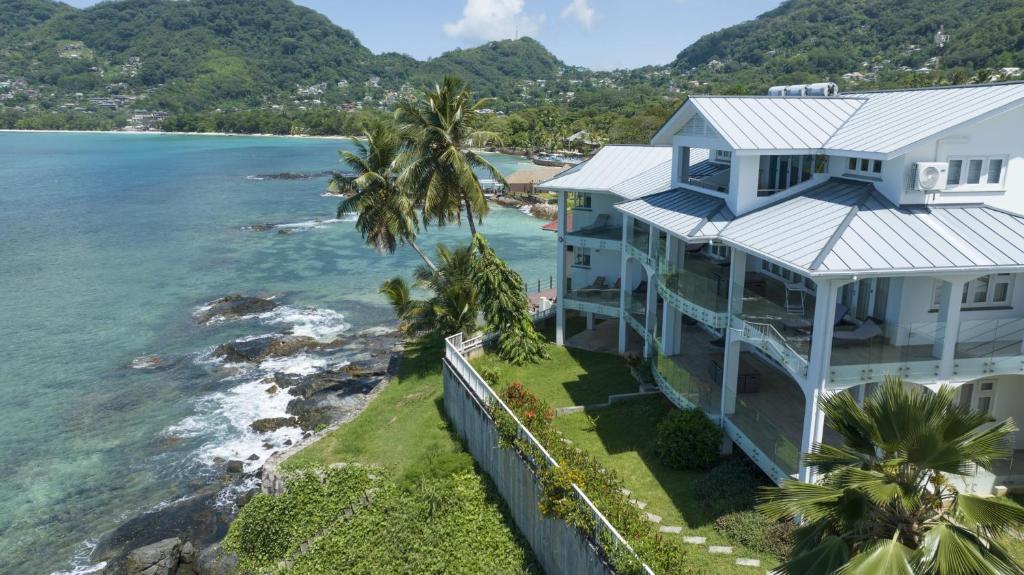 an aerial view of a house overlooking the ocean at VallonEnd Beachfront villa with excellent view in Bel Ombre