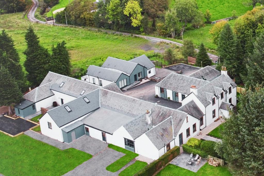 an aerial view of a house with many roofs at Rachel's Farm luxury escapes with Hots Tubs in Buchlyvie