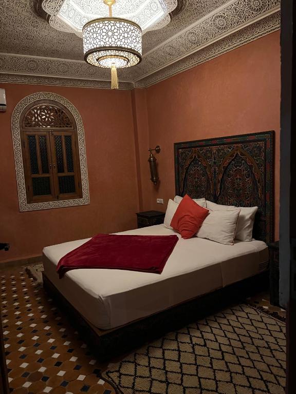 Postel nebo postele na pokoji v ubytování Riad le petit ksar