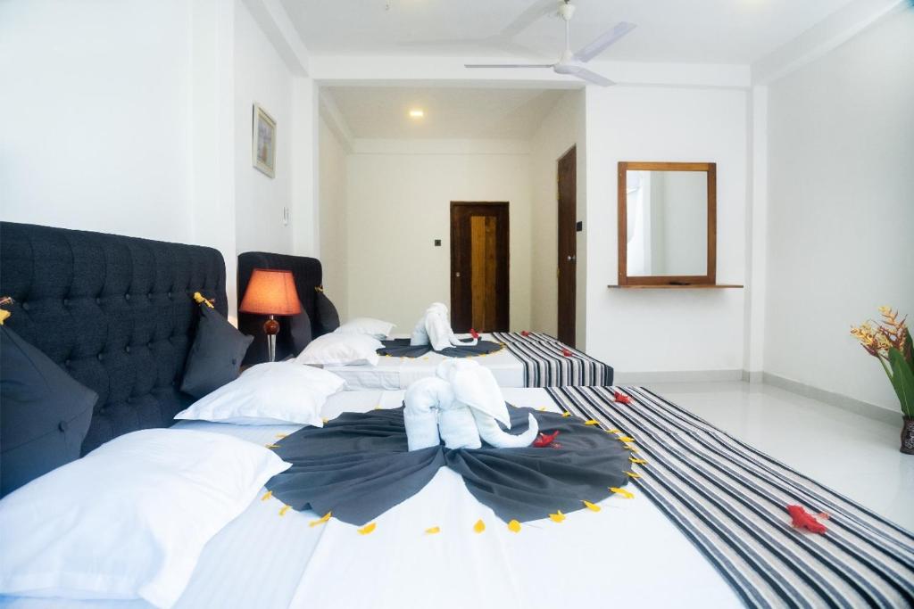 Voodi või voodid majutusasutuse Hotel Sapid Luck Yala Safari toas