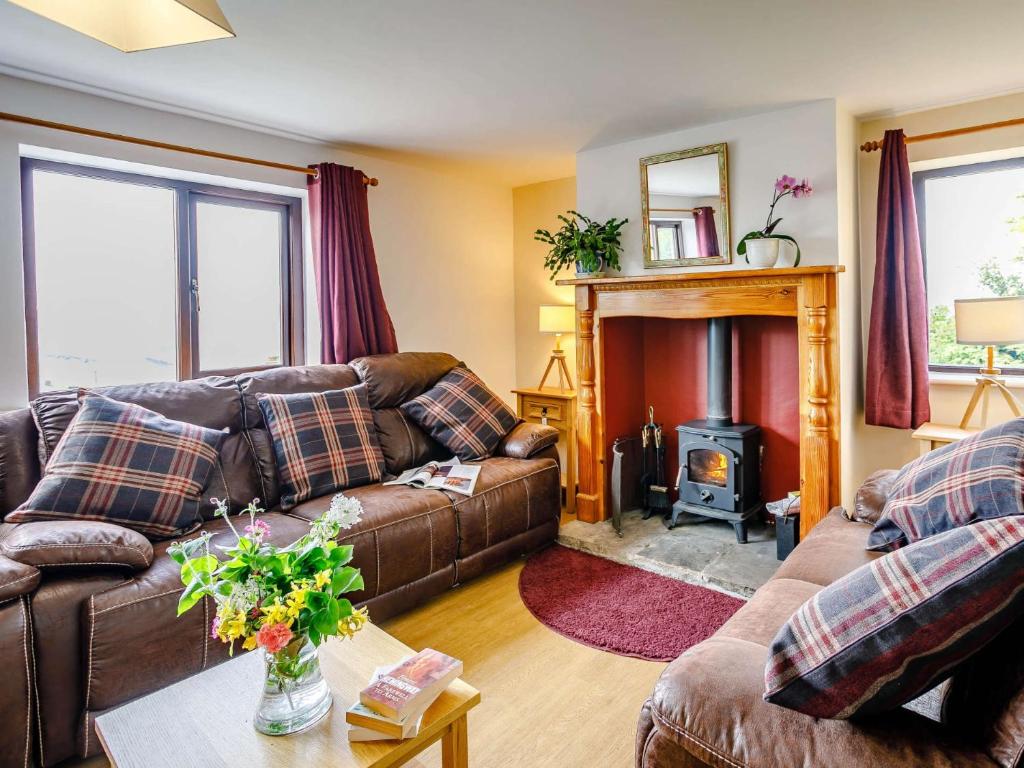 a living room with a couch and a fire place at 3 Bed in Todmorden 82953 in Todmorden