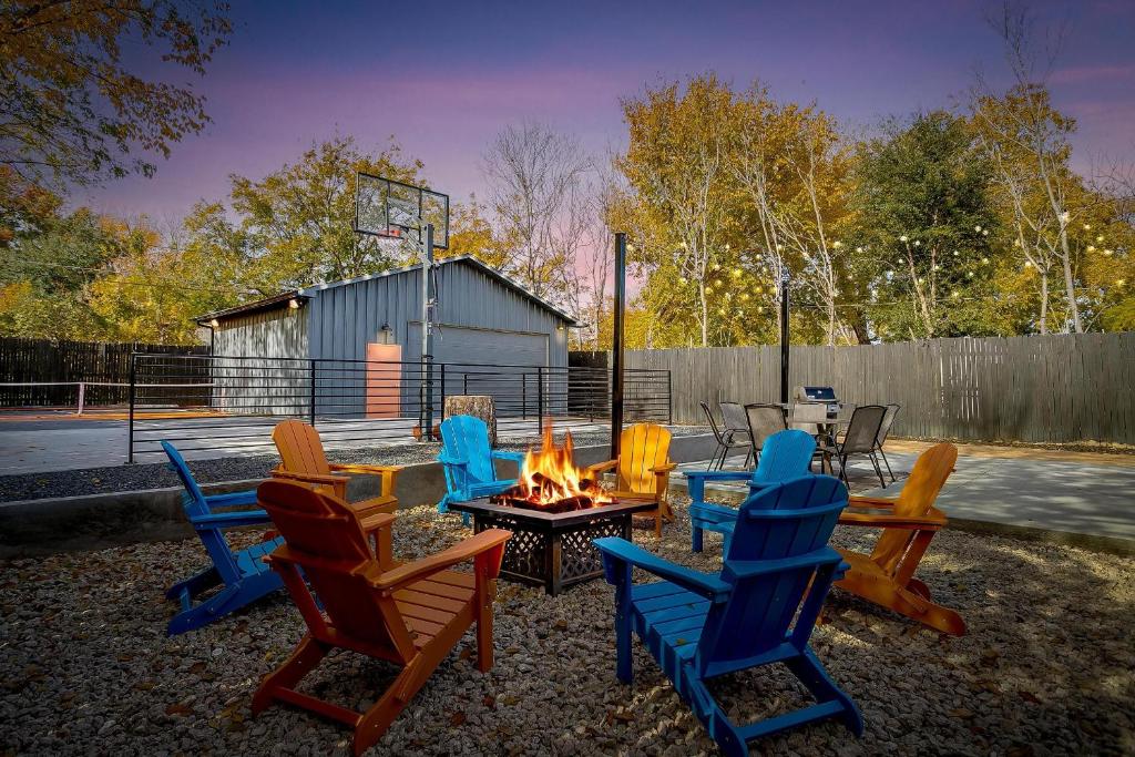 a group of chairs sitting around a fire pit at Pickleball Court - Walk to AT&T Stadium, Globe Life, Six Flags, Texas Live! & more in Arlington