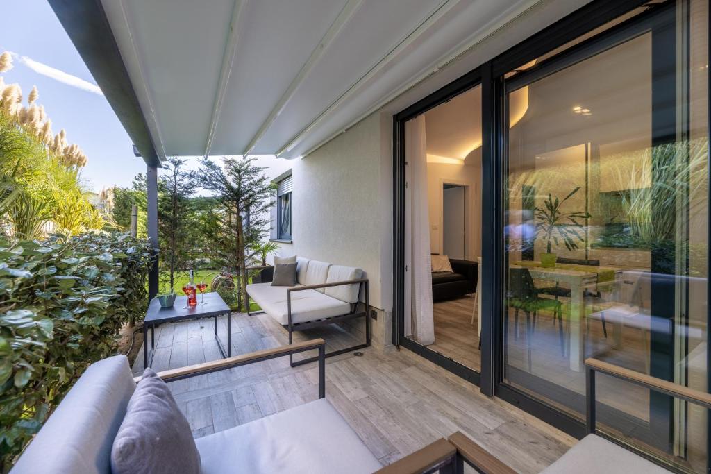 an outdoor living room with sliding glass doors at Villa Valis in Baška