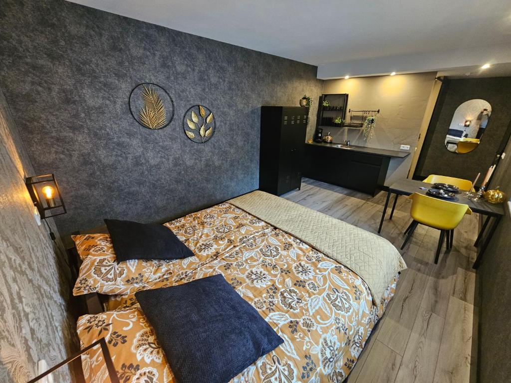 a hotel room with a bed and a desk at City Stay Juliette in Enschede