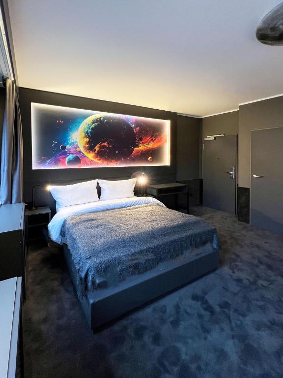 Postel nebo postele na pokoji v ubytování Sleephotels Cosmos