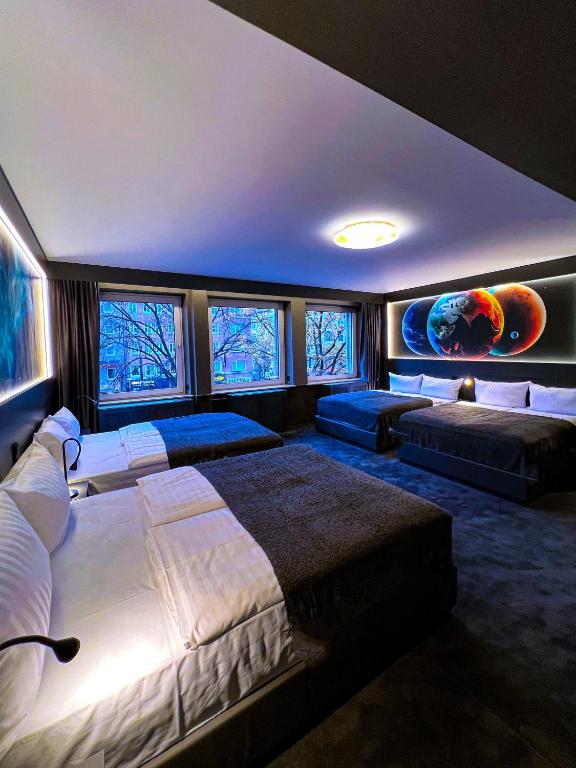 Postel nebo postele na pokoji v ubytování Sleephotels Cosmos
