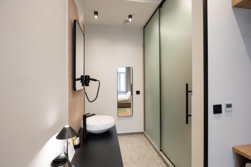 Koupelna v ubytování Hop Inn Rooms & Suites