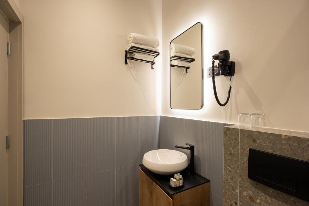 Koupelna v ubytování Hop Inn Rooms & Suites