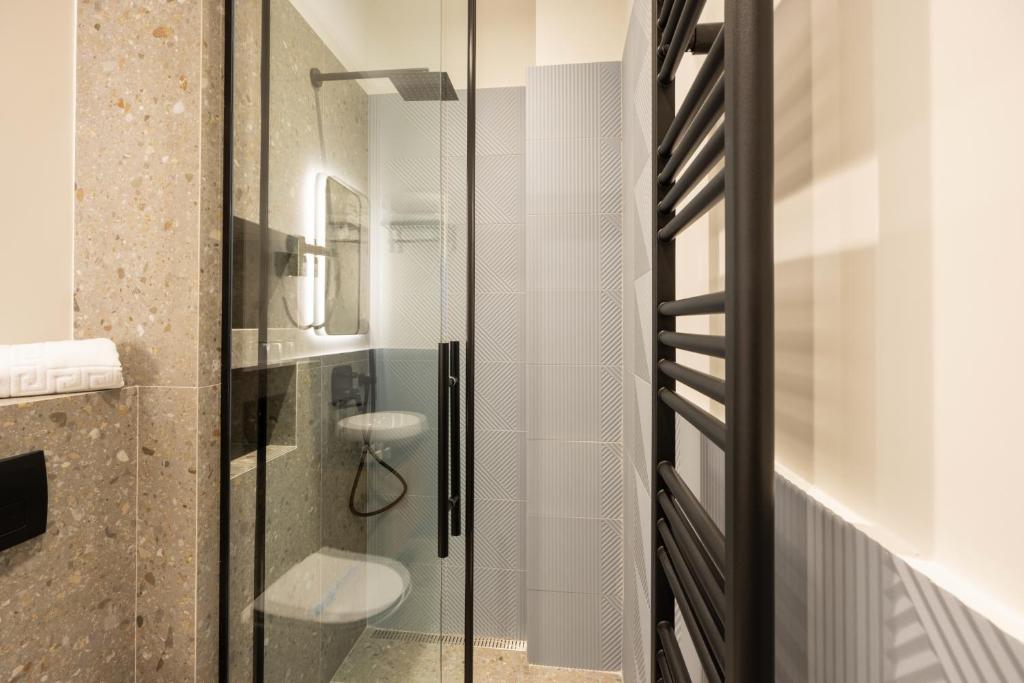 Koupelna v ubytování Hop Inn Rooms & Suites