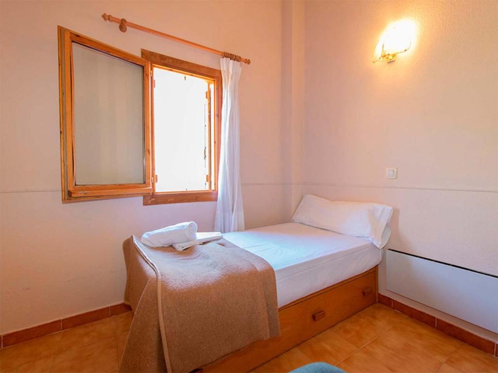 Postel nebo postele na pokoji v ubytování Apartamentos Villanua 3000