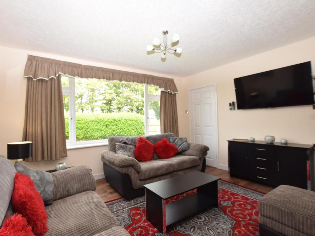 a living room with two couches and a flat screen tv at 3 bed property in Mablethorpe 43220 in Mablethorpe