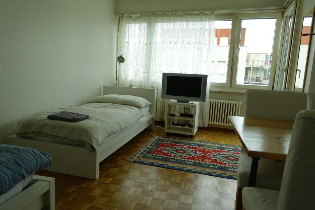 Кровать или кровати в номере Basel Rooms Appartements