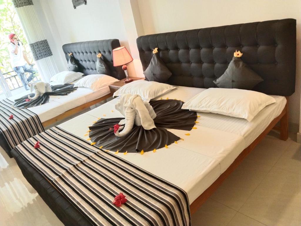 Voodi või voodid majutusasutuse Hotel Sapid Luck Yala Safari toas