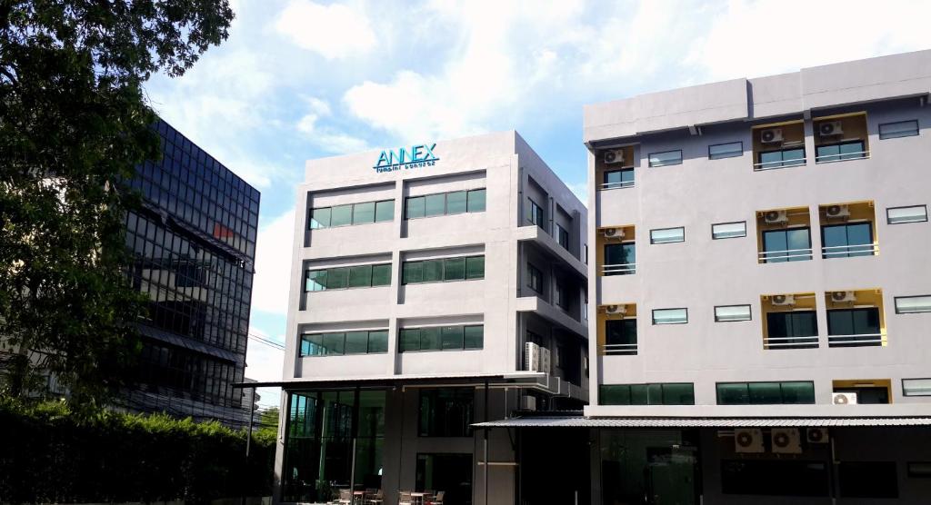 a large white building with an algas sign on it at Annex Lumpini Bangkok in Bangkok