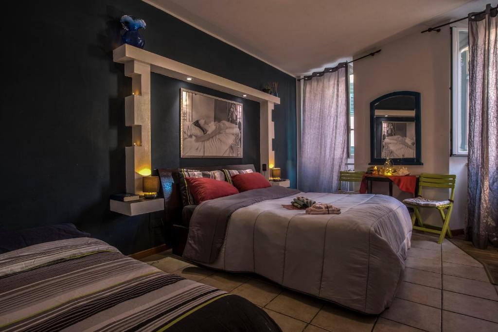 Postel nebo postele na pokoji v ubytování Lisetta Rooms