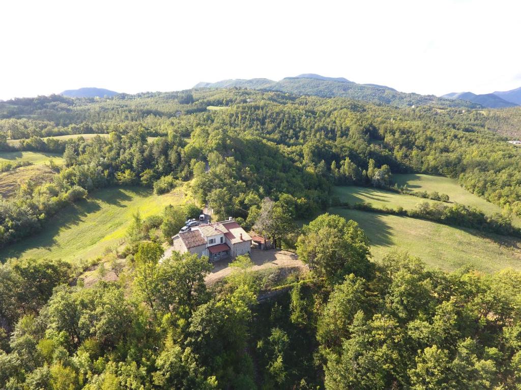 an aerial view of a house in the middle of a field at lassù minihotel 