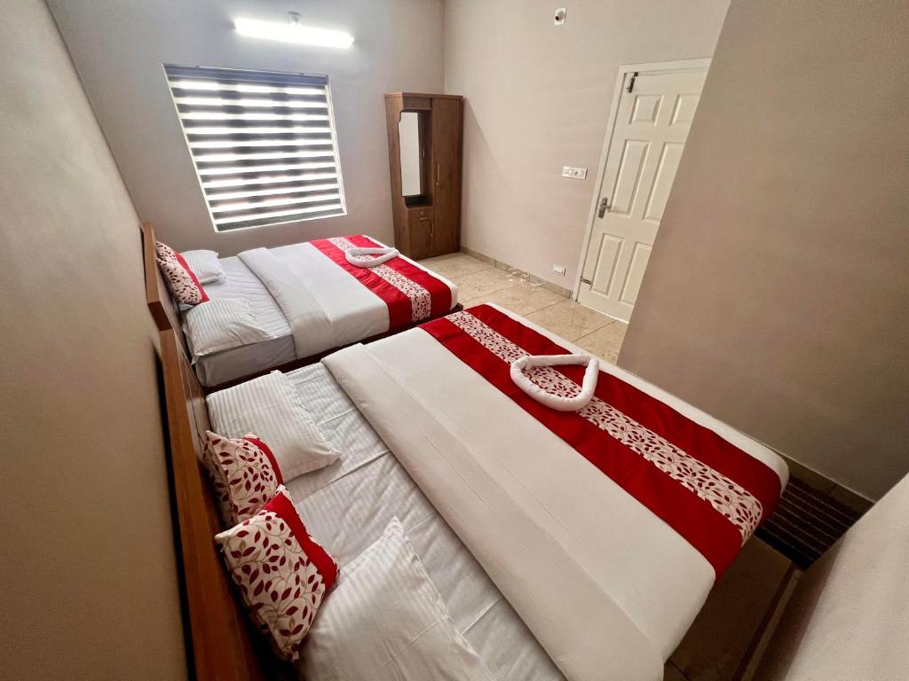 Postel nebo postele na pokoji v ubytování Luxe Hotel - Rooms & Villas Wayanad