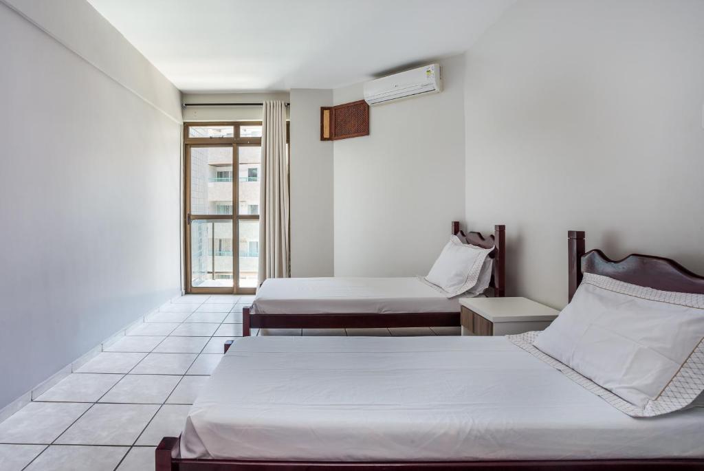Postel nebo postele na pokoji v ubytování Apart Hotel Porto Príncipe