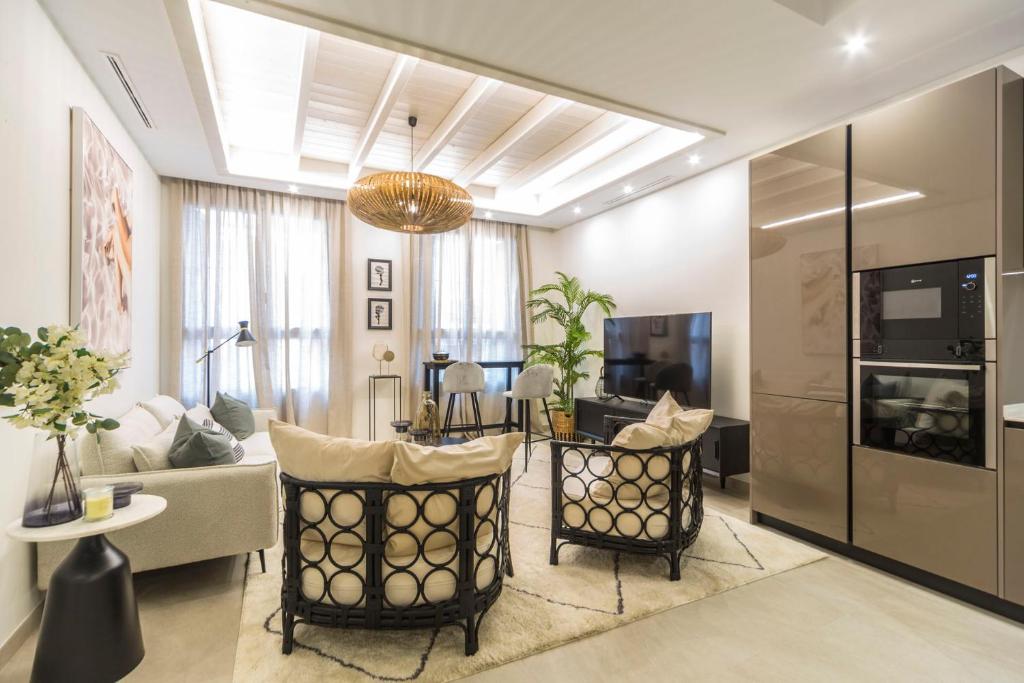 a living room with a couch and a table at CASONA 6 LUNAS APART Ba-BA1 in Marbella