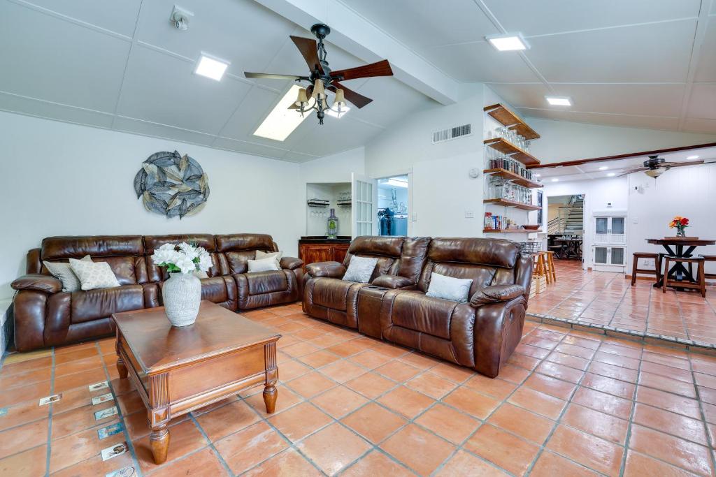 a living room with leather couches and a table at San Antonio Home Private Pool and Covered Patio in San Antonio