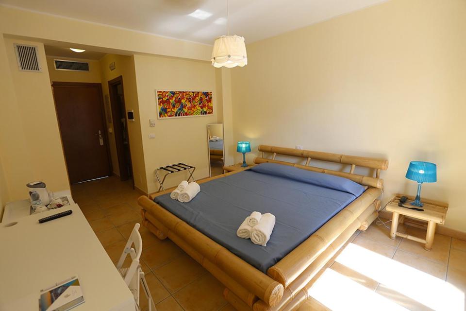 Postel nebo postele na pokoji v ubytování Le Saline Resort
