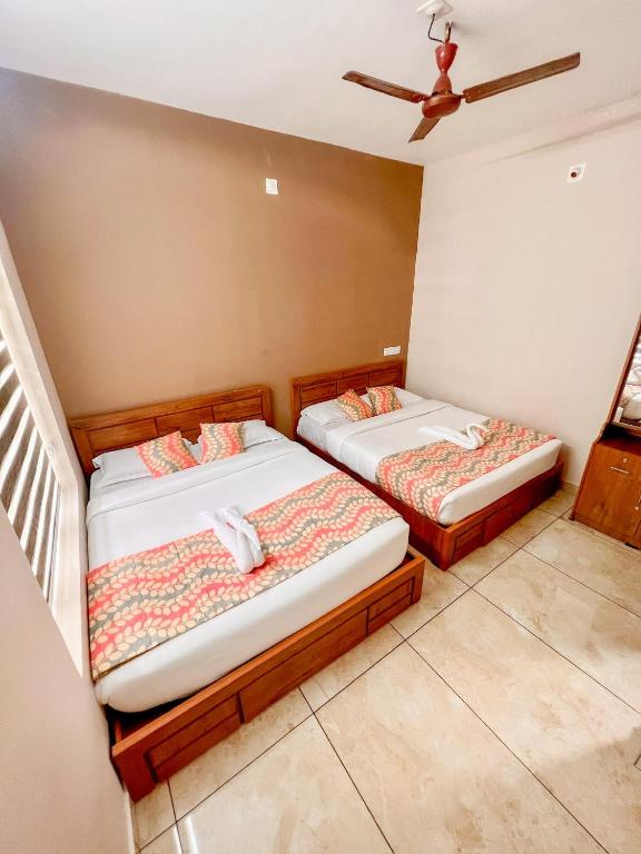 Postel nebo postele na pokoji v ubytování Luxe Hotel - Rooms & Villas Wayanad