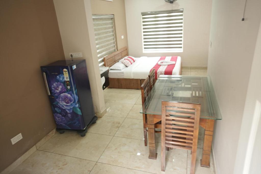 Postel nebo postele na pokoji v ubytování Luxe Hotel - Rooms & Villas Wayanad